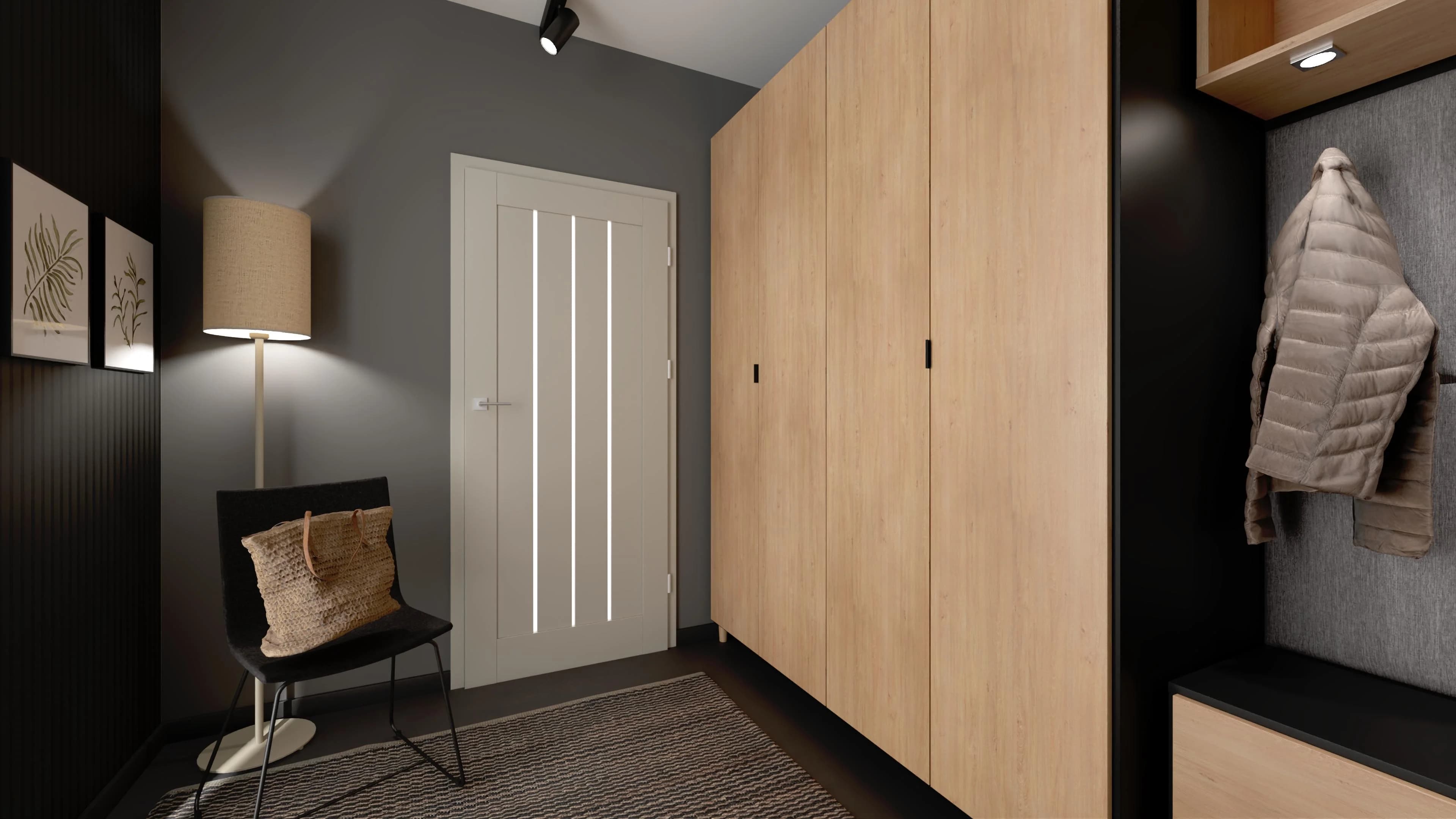 Mały, elegancki przedpokój z szafą i lustrem