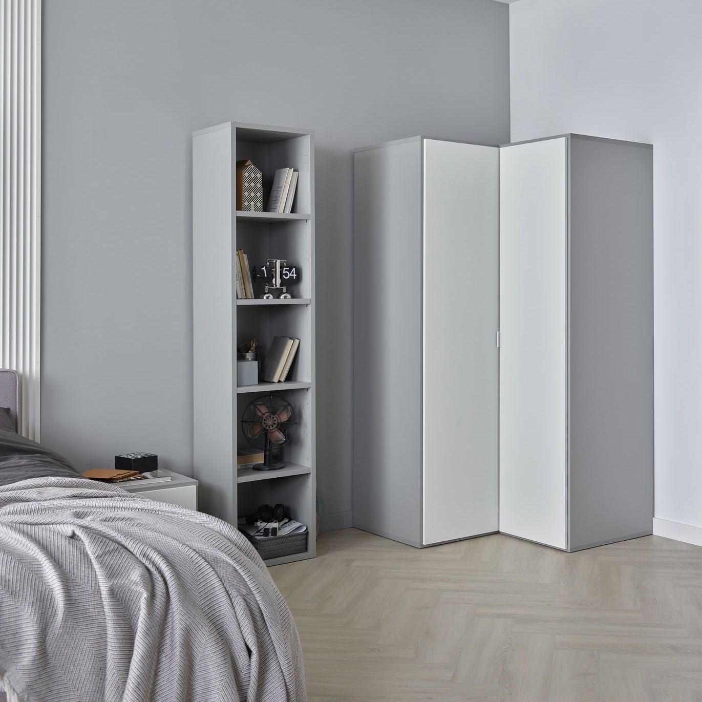 Minimalistyczna sypialnia w odcieniach szarości i bieli.